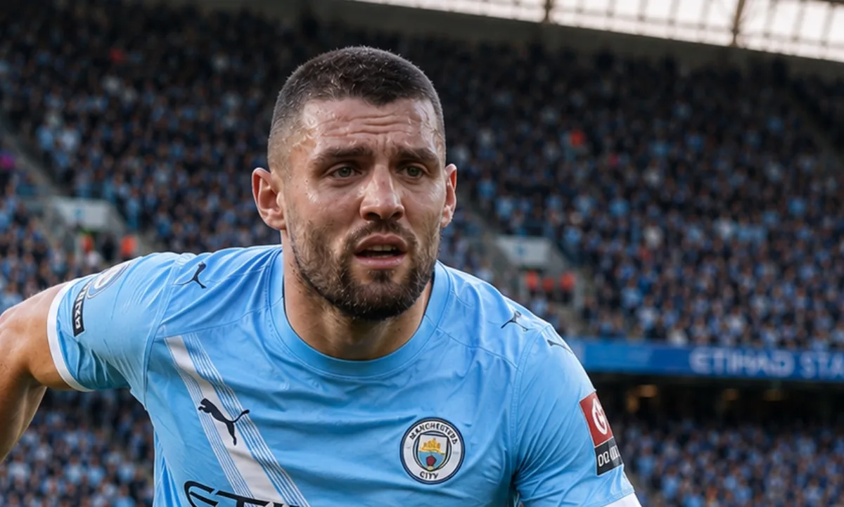 Mateo Kovacic in Manchester City training kit, smiling during a pre-season session at the Etihad Campus.